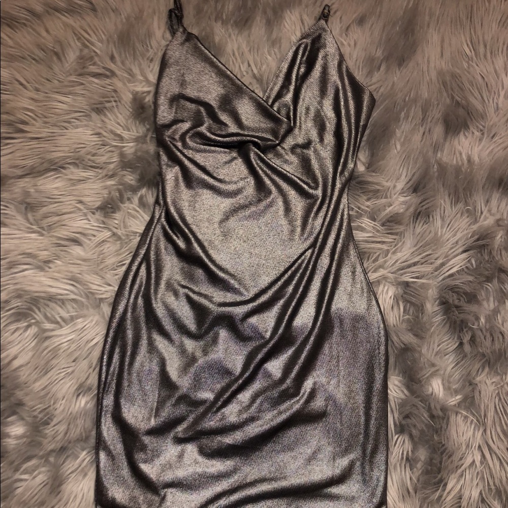 A cute mini grey, silver dress in size small